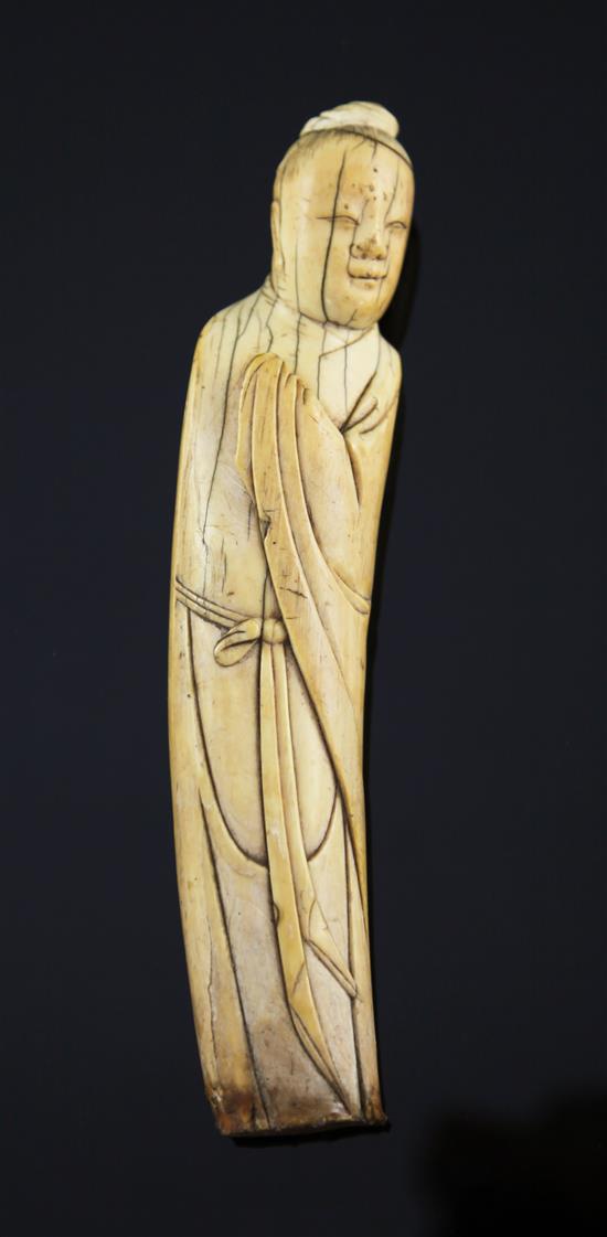 A Chinese ivory figure of a sage, late Ming dynasty, 20cm, age cracks, with stand